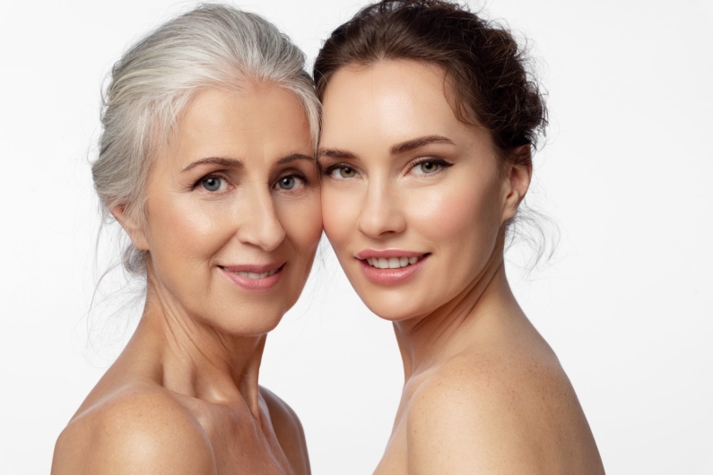 Group portrait of 2 women of different ages and skin types